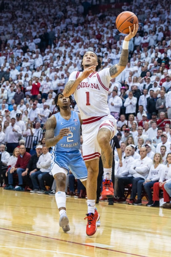 Indiana Hoosiers guard Jalen Hood-Schifino (1) shoots the ball while North Carolina Tar Heels guard Caleb Love (2) defends in the first half.